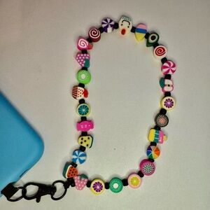 Cell phone wristlet from The Charm Hut works on any phone case